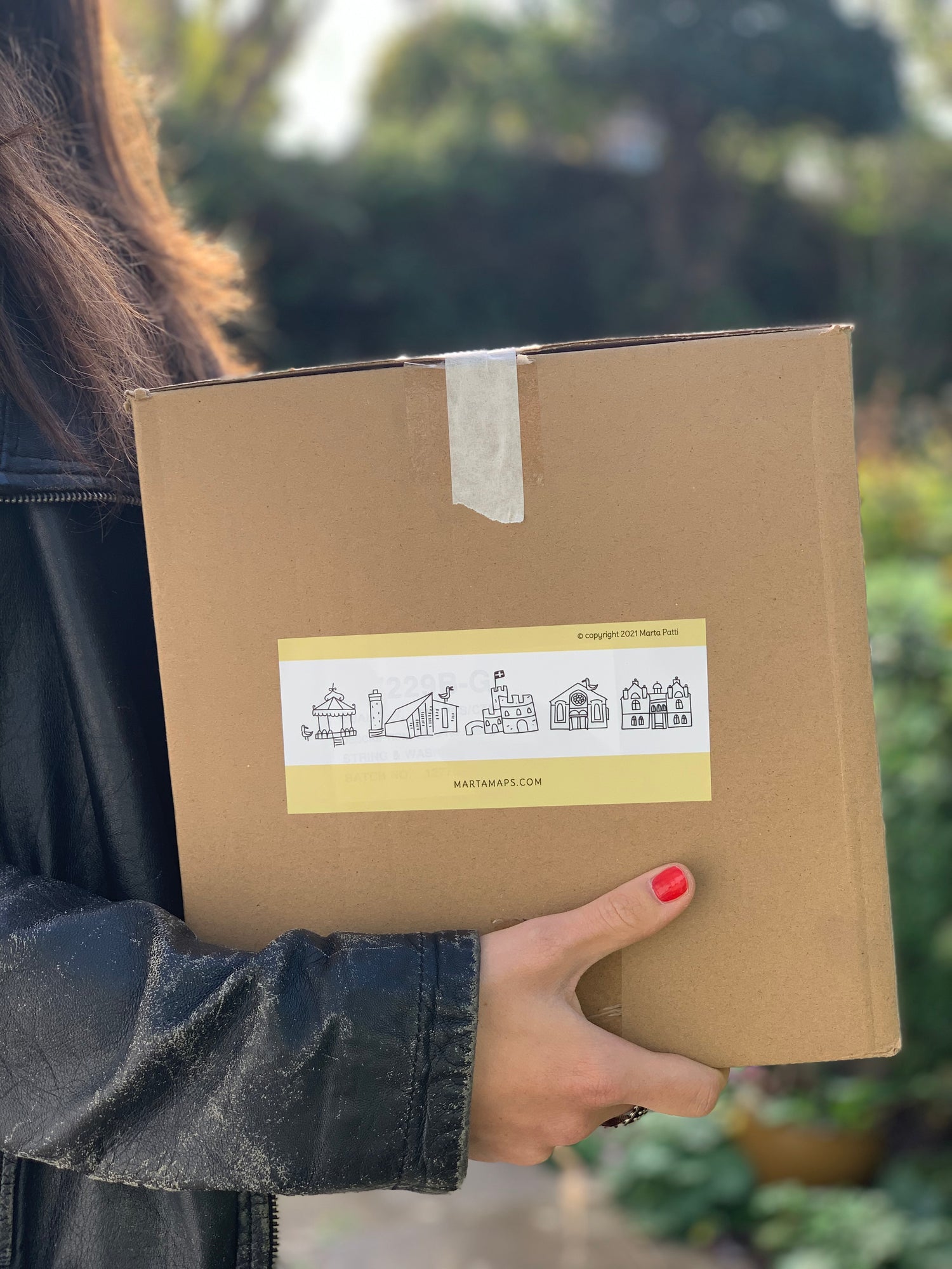 Marta holding a package