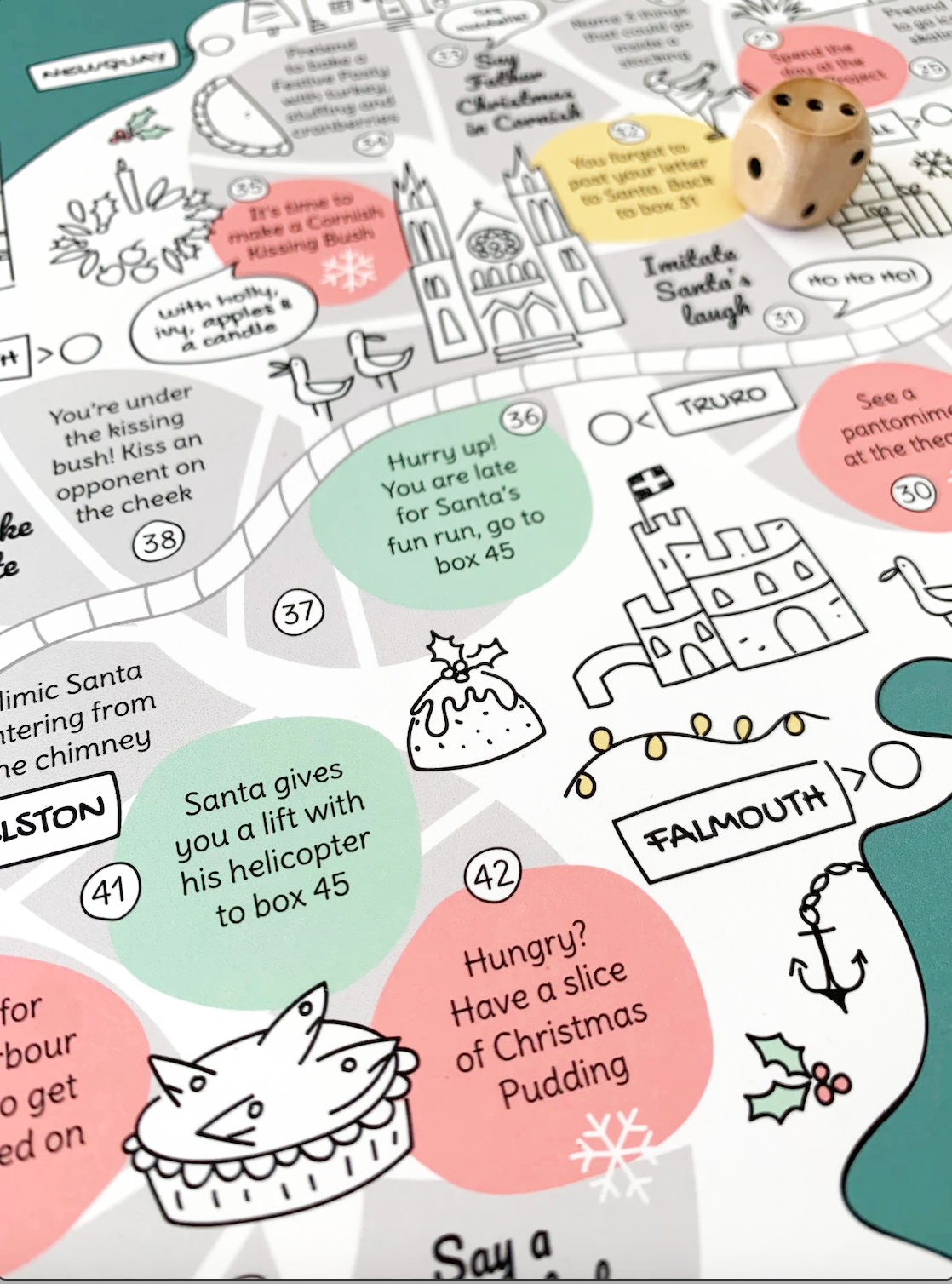 Cornwall Christmas board game detail with red wooden mark. Featuring Truro Cathedral and Pendennis Castle.