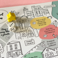 Fowey board game map detail with wooden dice and yellow marker, featuring the Place House and St Fimbarrus Parish Church.