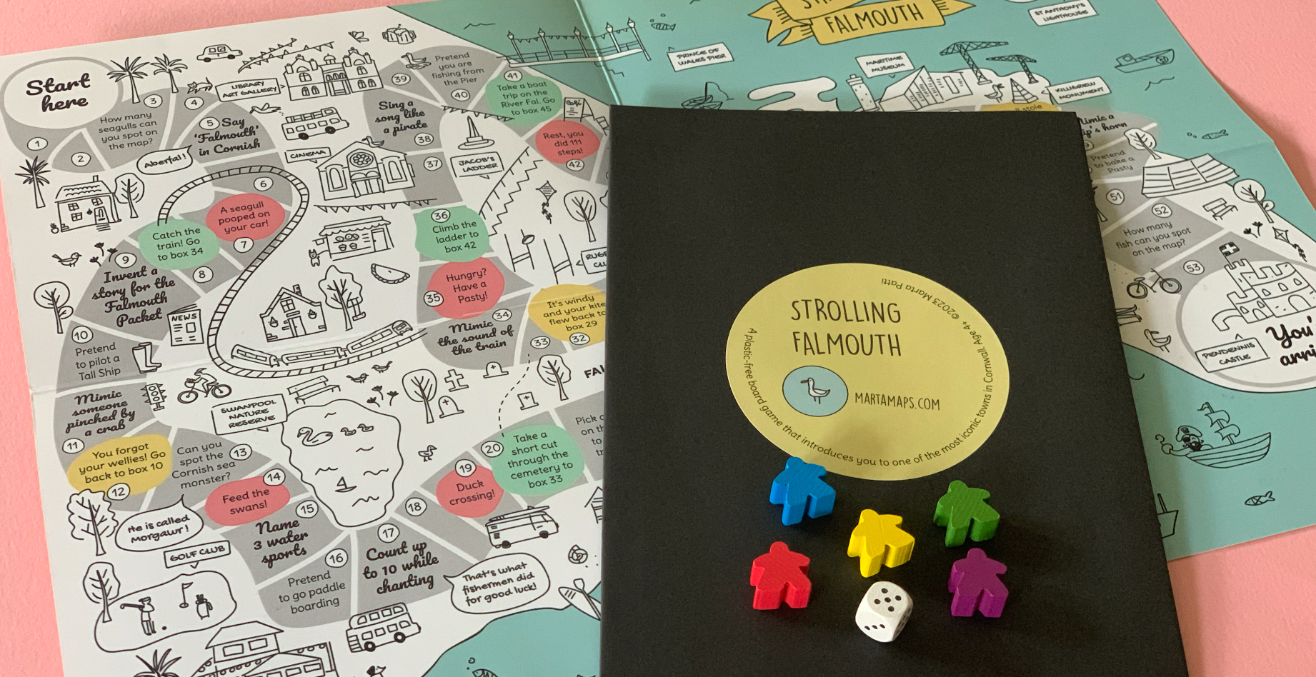 Cornish board game based on the map of Falmouth with a black envelope and wooden dice and markers.