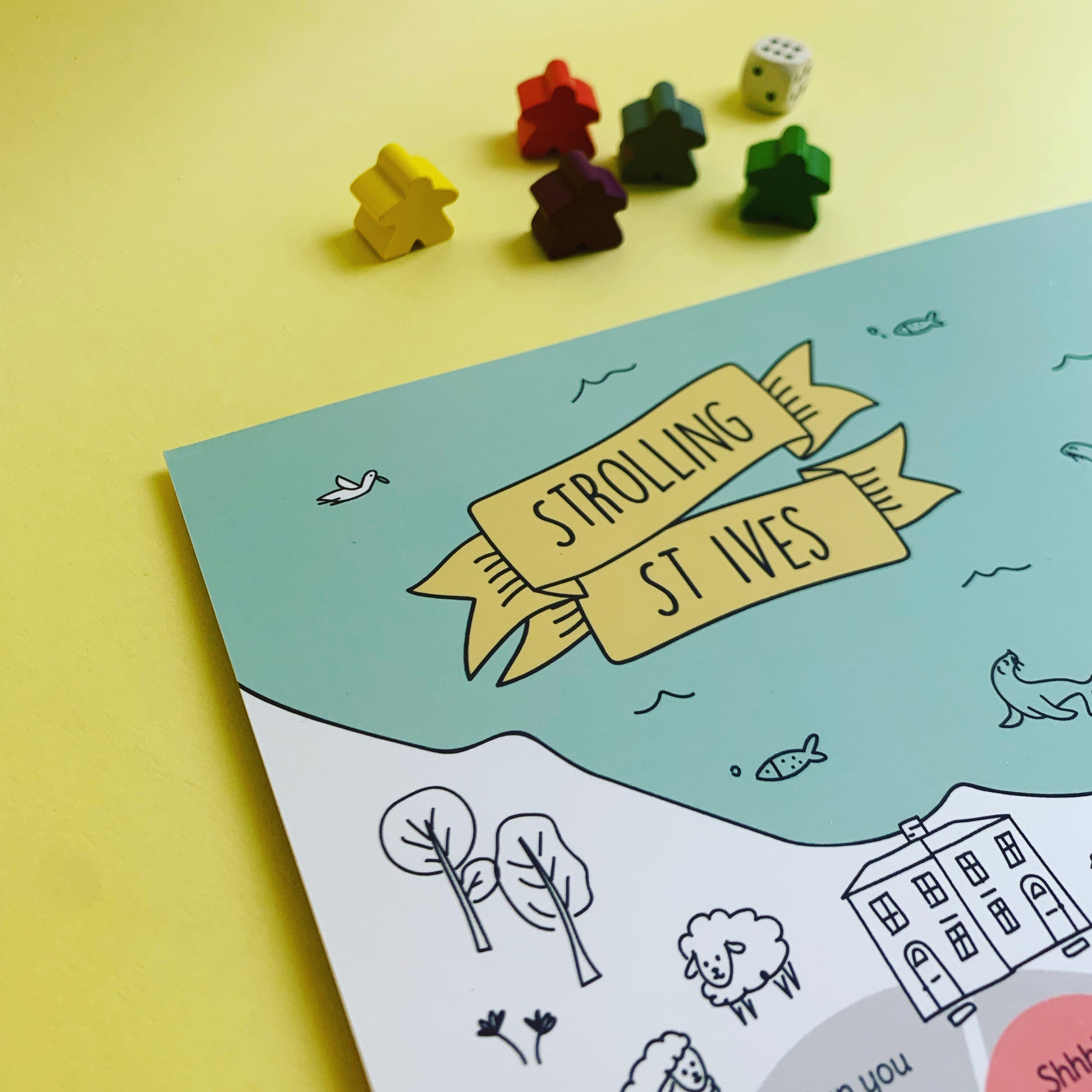 St ives board game detail with plastic free wooden and dice on yellow background.