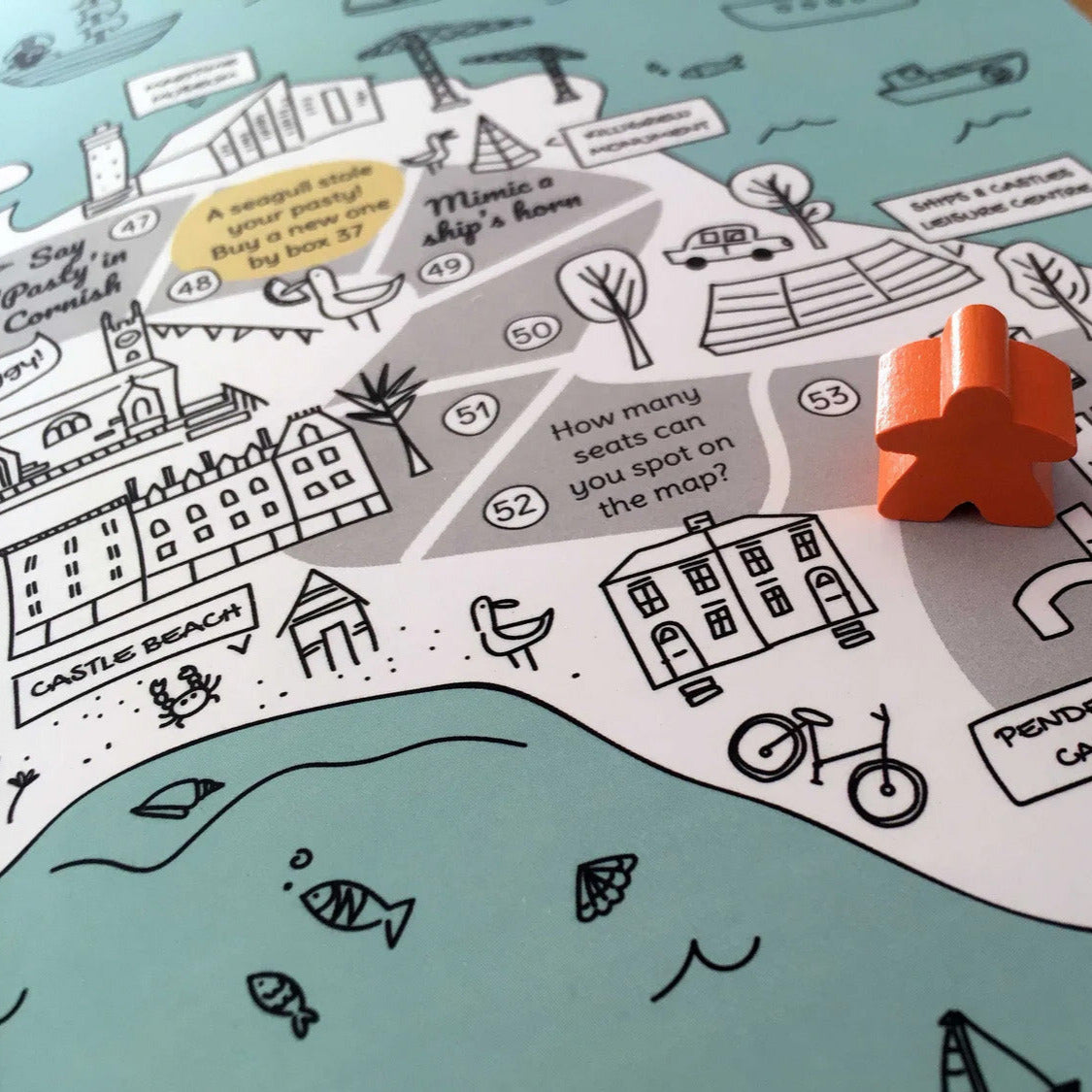 Falmouth board game map. Wooden dice and coloured marker.